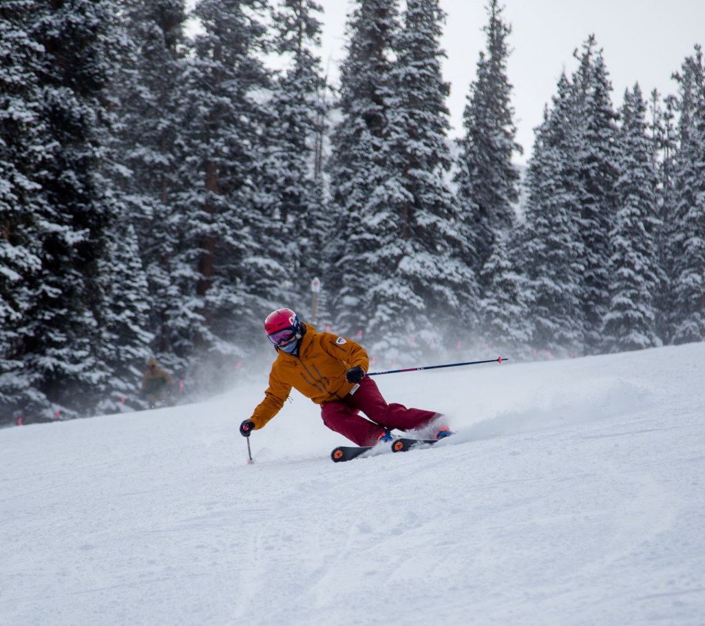 PSIA-AASI National Team member Jennifer Simpson Weier skis down a run